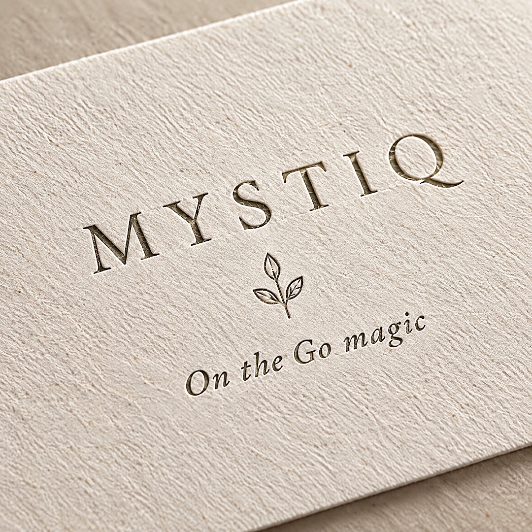 Mystiq Elixir — embossed logo on textured paper